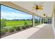 Enjoy outdoor living on this expansive covered lanai with views of the green lawn and manicured landscaping at 4419 Nw 54Th Ter, Ocala, FL 34482