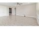 Open living room with neutral tones, ceiling fan and double door closet at 4419 Nw 54Th Ter, Ocala, FL 34482