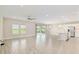 Bright open living room featuring neutral paint and luxury plank flooring, with outdoor views at 4419 Nw 54Th Ter, Ocala, FL 34482