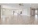 Bright, expansive living room offering an open layout to the kitchen and front entry at 4419 Nw 54Th Ter, Ocala, FL 34482