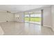 Bright and spacious living room with sliding doors leading to the outdoor patio and yard at 4419 Nw 54Th Ter, Ocala, FL 34482