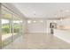 Bright living room with view of kitchen and patio through glass doors at 4419 Nw 54Th Ter, Ocala, FL 34482