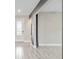 Open-concept living area with neutral walls and tile flooring, creating a bright and airy space at 4419 Nw 54Th Ter, Ocala, FL 34482