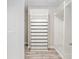Walk-in closet offering customizable storage solutions and wood-look tile flooring at 4419 Nw 54Th Ter, Ocala, FL 34482
