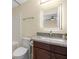Bathroom features modern vanity, granite countertop, stainless steel faucet, and square lighted mirror at 458 Marion Oaks Trail Trl, Ocala, FL 34473