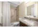 Full bathroom featuring walk in shower, shower curtain, granite countertop and lighted mirror at 458 Marion Oaks Trail Trl, Ocala, FL 34473