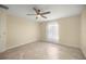 Bright and airy bedroom with a ceiling fan, tile floors, and brightly lit window at 458 Marion Oaks Trail Trl, Ocala, FL 34473