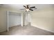 Bedroom features a closet, ceiling fan, and brightly lit window at 458 Marion Oaks Trail Trl, Ocala, FL 34473