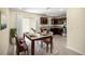 Dining area featuring a glass table, seating for six, and sliding glass doors at 458 Marion Oaks Trail Trl, Ocala, FL 34473
