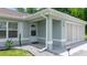 Close-up of the entryway with details of siding, rock garden, and house number at 458 Marion Oaks Trail Trl, Ocala, FL 34473