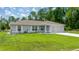 Inviting single-story home with a well-kept lawn and attached garage at 458 Marion Oaks Trail Trl, Ocala, FL 34473