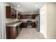 Updated kitchen featuring stainless appliances, dark wood cabinets, and tiled flooring at 458 Marion Oaks Trail Trl, Ocala, FL 34473