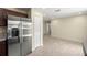 Open kitchen with stainless steel refrigerator and ample cabinet space at 458 Marion Oaks Trail Trl, Ocala, FL 34473