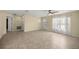 Open living room featuring tile floors, a front door, and a large window at 458 Marion Oaks Trail Trl, Ocala, FL 34473