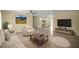 Bright living room featuring neutral decor, a ceiling fan, and decorative wall art at 458 Marion Oaks Trail Trl, Ocala, FL 34473