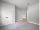 Neutral colored bedroom featuring an ensuite bathroom and walk in closet at 5 Larch Course Ter, Ocala, FL 34480