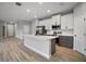 Contemporary kitchen with white cabinets, stainless steel appliances, and a spacious island at 5 Larch Course Ter, Ocala, FL 34480