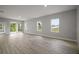 Open living area with sliding glass doors and multiple windows providing abundant natural light at 5 Larch Course Ter, Ocala, FL 34480