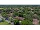 Aerial view of multi-Gathering residences with mature trees and landscaping at 505 Fairways Ln # B, Ocala, FL 34472