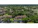 Aerial view of the condo community surrounded by mature trees and lush landscaping at 505 Fairways Ln # B, Ocala, FL 34472
