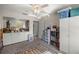Neutral bedroom with fan, carpet, built-ins, storage and view to the outside at 505 Fairways Ln # B, Ocala, FL 34472