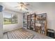 Bedroom with plush carpet, window view, and multiple built in bookshelves at 505 Fairways Ln # B, Ocala, FL 34472