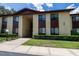 The condo building boasts neat landscaping and a neutral color scheme at 505 Fairways Ln # B, Ocala, FL 34472