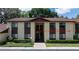 Exterior view of a two-story condo with a brown roof and well-maintained landscaping at 505 Fairways Ln # B, Ocala, FL 34472