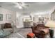 Inviting living room with comfortable seating and an open layout to the kitchen and dining area at 505 Fairways Ln # B, Ocala, FL 34472