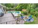 This stunning backyard boasts a pool, a wooden deck, and a stone fire pit at 510 Se 19Th St, Ocala, FL 34471