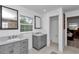 The bright bathroom is equipped with dual sinks, granite countertops, and tiled floors at 510 Se 19Th St, Ocala, FL 34471