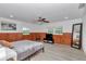 A spacious bedroom features wood flooring, a ceiling fan, and a large mirror at 510 Se 19Th St, Ocala, FL 34471