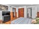 Bedroom with closet, TV and a view of bathroom at 510 Se 19Th St, Ocala, FL 34471