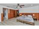 The bright bedroom offers wood-look floors, a closet, and a private ensuite bathroom at 510 Se 19Th St, Ocala, FL 34471