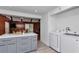 Open-concept kitchen featuring a spacious island, modern appliances, and convenient access to the laundry area at 510 Se 19Th St, Ocala, FL 34471