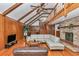 Living room with vaulted ceiling, brick fireplace, and hardwood floors at 510 Se 19Th St, Ocala, FL 34471