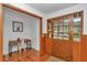 Cozy entryway with a functional office nook, featuring hardwood floors and ample natural light at 510 Se 19Th St, Ocala, FL 34471