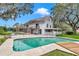 A backyard pool and deck area provide a beautiful area to entertain guests or relax in this backyard oasis at 510 Se 19Th St, Ocala, FL 34471