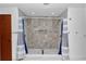 This stylish shower includes a tile surround, a niche for storage, and dual shower heads at 510 Se 19Th St, Ocala, FL 34471