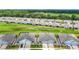 Overhead view of new homes with manicured lawns and paved driveways in a modern residential neighborhood at 5233 Nw 43Rd Lane Rd, Ocala, FL 34482