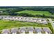 Wide aerial view shows the community and surrounding green space and a forest at 5233 Nw 43Rd Lane Rd, Ocala, FL 34482
