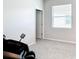 Bedroom featuring light grey walls, carpet, a massage chair, and a window with blinds at 5233 Nw 43Rd Lane Rd, Ocala, FL 34482