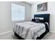Comfortable bedroom featuring a stylish bed with a tufted headboard, soft bedding, and modern wall art at 5233 Nw 43Rd Lane Rd, Ocala, FL 34482