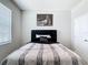 Charming bedroom features stylish bed with tufted headboard and a modern print above at 5233 Nw 43Rd Lane Rd, Ocala, FL 34482
