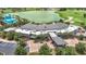Aerial view of the clubhouse featuring a covered entrance, nearby parking, and convenient access for community members at 5233 Nw 43Rd Lane Rd, Ocala, FL 34482
