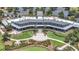 Aerial view of the community clubhouse with outdoor seating, manicured landscaping, and decorative architectural elements at 5233 Nw 43Rd Lane Rd, Ocala, FL 34482