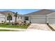Attractive home with a two-car garage, brick driveway, and well-maintained landscaping at 5233 Nw 43Rd Lane Rd, Ocala, FL 34482
