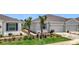 Charming single-story home featuring a two-car garage and beautifully landscaped front yard at 5233 Nw 43Rd Lane Rd, Ocala, FL 34482