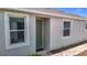 Charming home exterior showcases large windows and inviting entry door at 5233 Nw 43Rd Lane Rd, Ocala, FL 34482
