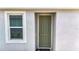 Welcoming home entrance with a stylish front door and sidelight window at 5233 Nw 43Rd Lane Rd, Ocala, FL 34482